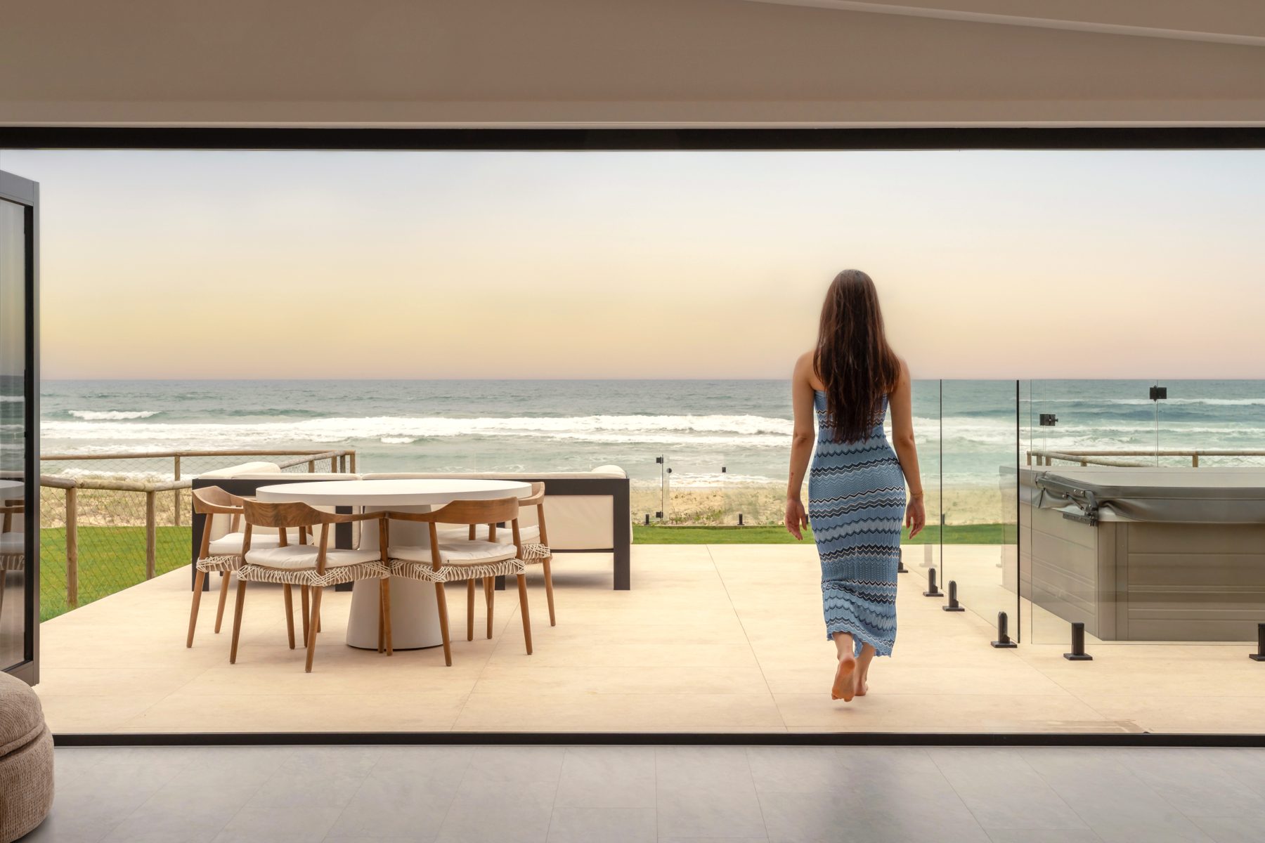 Coastal property terrace photographed at golden hour